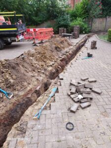 Excavated trench for new pipework
