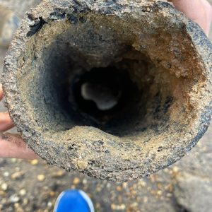 Photo of blistered pitch fibre drain pipe